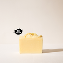 A pale yellow bar soap without it's packaging on a light background with a best seller tag