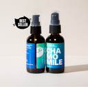Two Bottles of Chamomile Body Oil on a light background with a best seller sticker