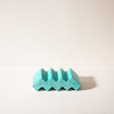 A step shaped concrete soap dish