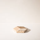 A hexagon shaped concrete soap dish