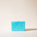 A blue bar of R and R soap without wrapping paper
