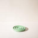 A raindrop shaped concrete soap dish